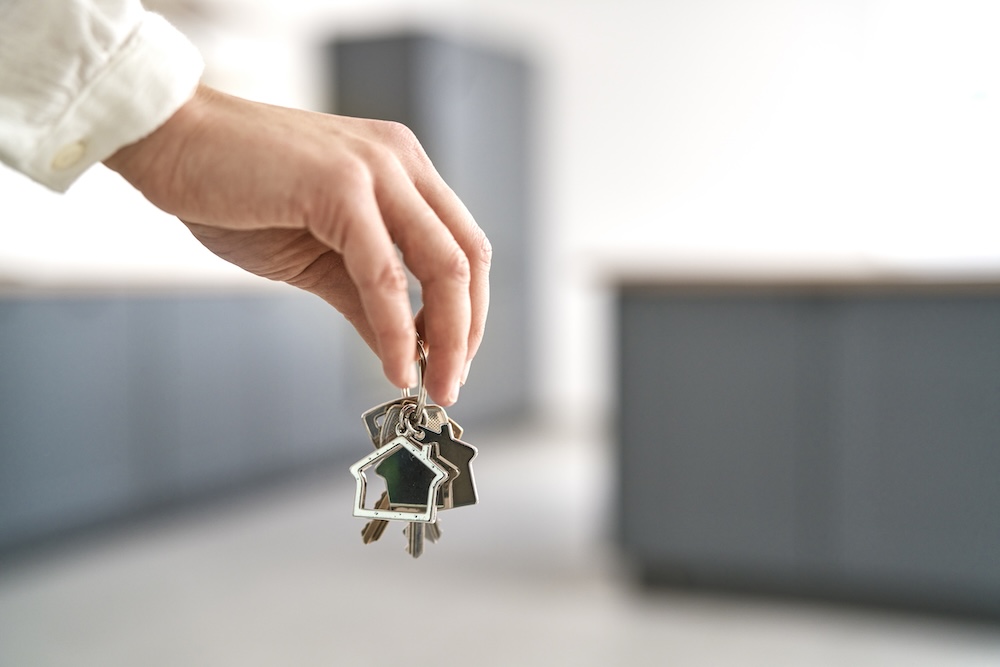 Unrecognizable hand holding a bunch of keys for new house